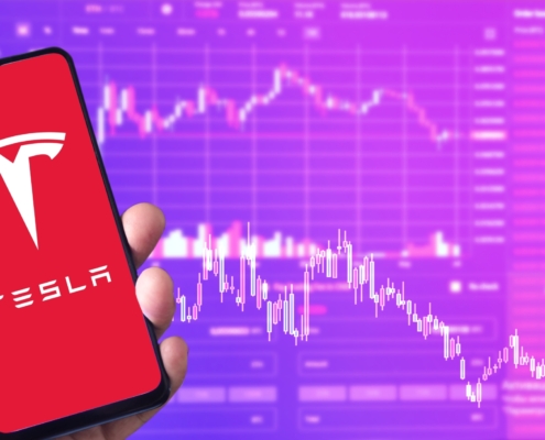 Tesla logo and stock price chart